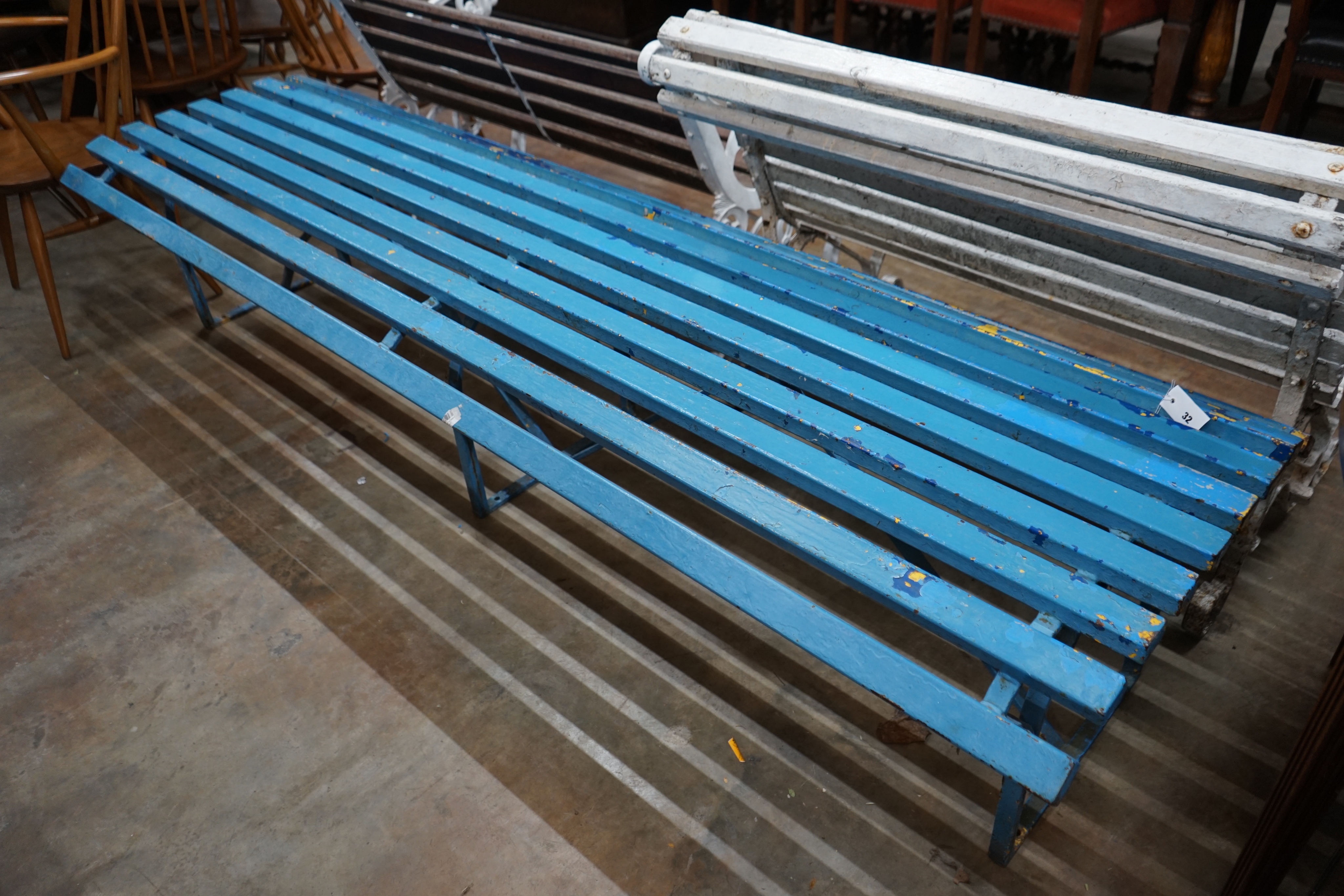 A painted slatted wrought iron park or station platform bench, length 240cm depth 70cm height 50cm
